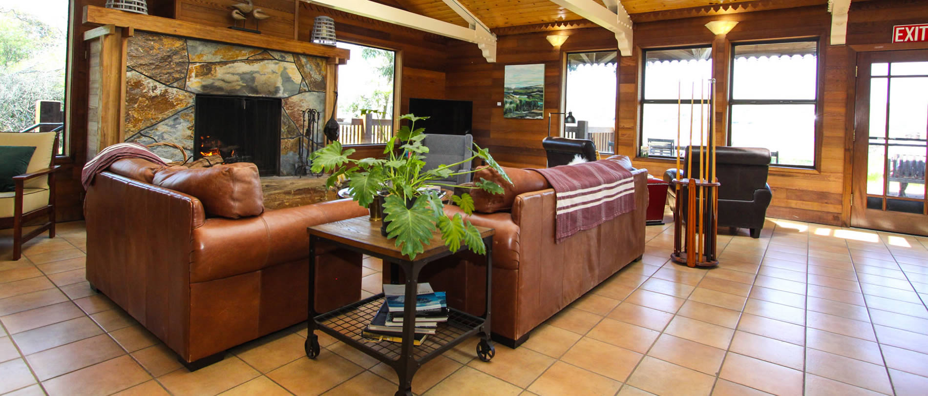 lodge sitting area with stone fireplace